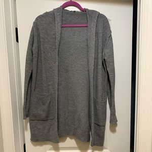 Long-ish gray sweater with hood and pockets